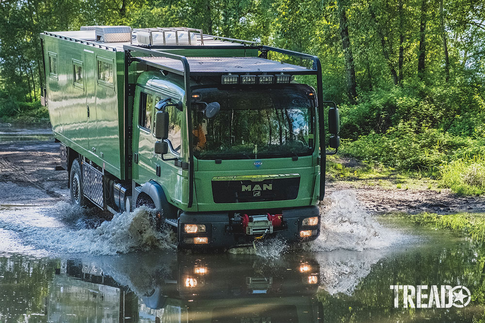 A Mint Green Man Truck Travels Internationally